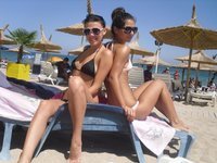 Two amateur teen GFs topless at beach
