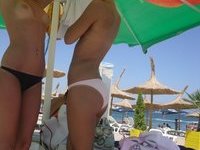 Two amateur teen GFs topless at beach