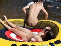 Nudist amateur couple at lake