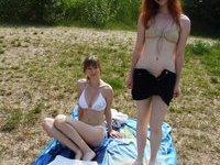 Two amateur teen GFs posing together at lake