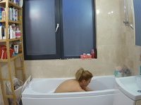 Blonde amateur wife topless at home