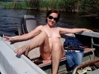My wife sunbathing naked at boat