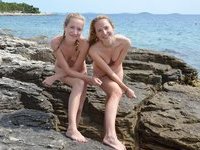 Two amateur teen GFs posing together at seaside