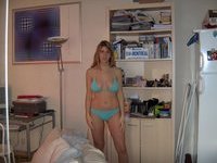 Busty blonde amateur wife posing on bed