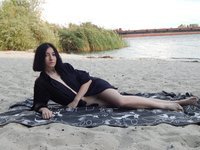 Amateur brunette posing at riverside