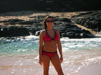 Young brunette shaved MILF earning her beach vacation