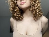 Curly haired sexy busty MILF