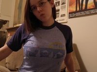 Amateur teen with glasses showing her tits