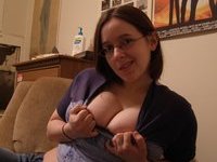 Amateur teen with glasses showing her tits