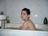 Brunette wife showering before sex