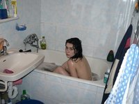 Brunette wife showering before sex