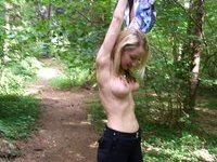 Blond amateur MILF posing at forest