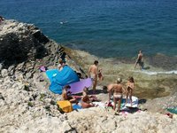 Nudist amateurs at beach and yacht