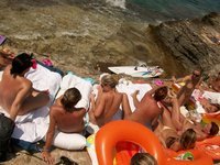 Nudist amateurs at beach and yacht