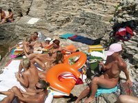 Nudist amateurs at beach and yacht