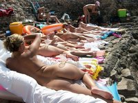 Nudist amateurs at beach and yacht