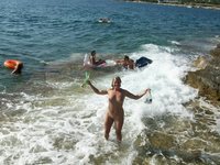 Nudist amateurs at beach and yacht