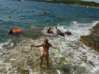 Nudist amateurs at beach and yacht