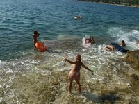 Nudist amateurs at beach and yacht
