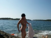 Nudist amateurs at beach and yacht