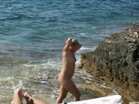 Nudist amateurs at beach and yacht