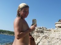 Nudist amateurs at beach and yacht