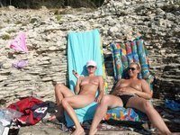 Nudist amateurs at beach and yacht