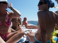 Nudist amateurs at beach and yacht