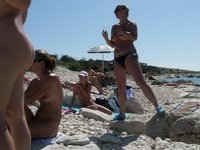 Nudist amateurs at beach and yacht