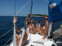 Nudist amateurs at beach and yacht