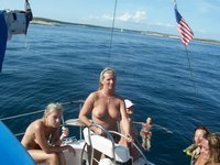 Nudist amateurs at beach and yacht