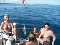 Nudist amateurs at beach and yacht