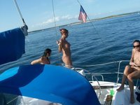 Nudist amateurs at beach and yacht