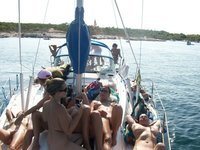 Nudist amateurs at beach and yacht