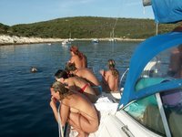 Nudist amateurs at beach and yacht