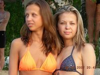 Nudist amateur couple with friends at beach