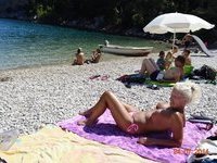 Sexy blonde Rachel topless at beach