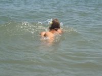 Rita teasing at beach