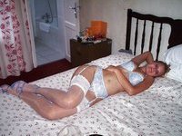 Amateur blonde wife posing on bed