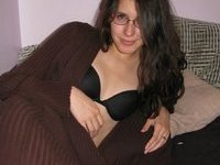Amateur brunette girl nude posing on bed