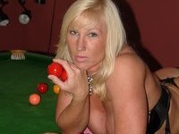Busty blond MILF fucked at pool room