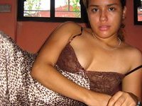 Latino amateur girl posing at home