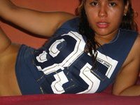Latino amateur girl posing at home