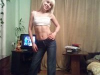 Cute amateur blonde posing at home