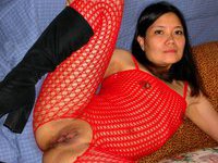Asian babe in fishnets