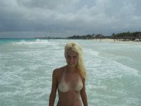 Toples blonde beach girl