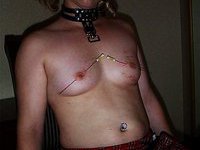 Torturing her hard nipples