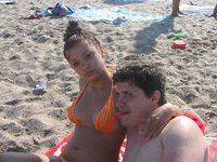 Nude couple sunbathing and teasing