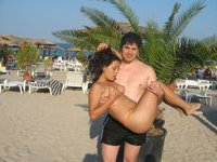 Nude couple sunbathing and teasing