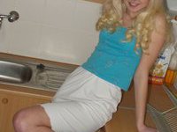 Blonde nude teen in the kitchen